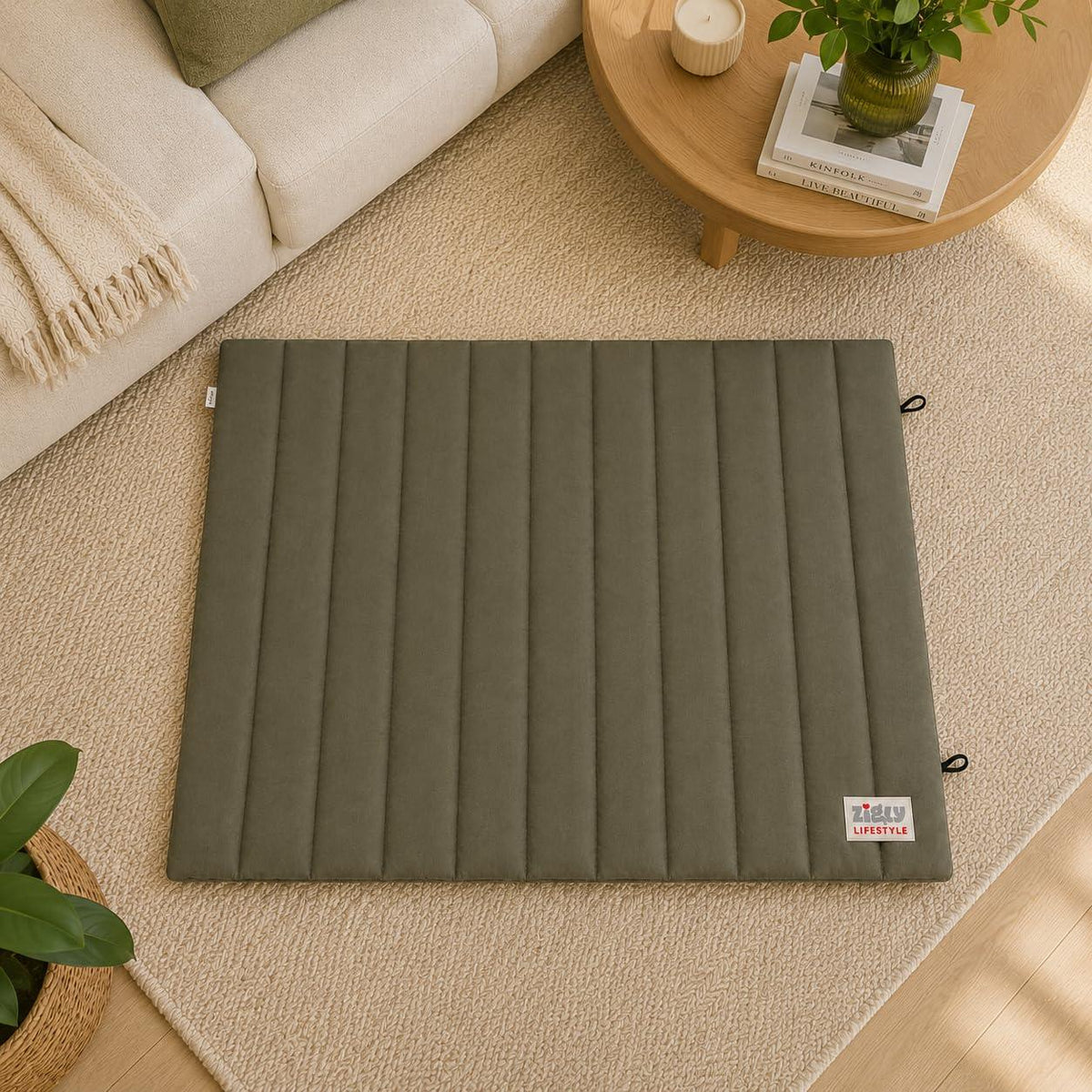Zigly Lifestyle olive green Snooze Nest pet mat on a beige rug in a living room