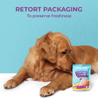 Golden retriever dog lying next to applod chicken & lamb dog food pouch with zigly retort packaging and freshness text