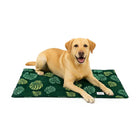 Golden Labrador dog lying happily on green leaf-patterned Zigly pet mat