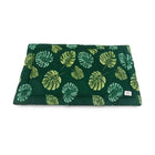 Zigly green leaf-patterned tropical cushion with vibrant yellow and teal monstera leaves
