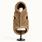 Zigly brown plush dog hoodie with hood and armholes on a black stand