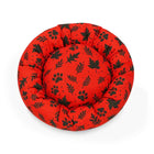 Zigly red round pet bed with black leaf and paw prints pattern