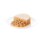 Zigly wet pet food with soft texture on a white plate, isolated background
