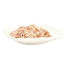 Shredded wet cat food on a white plate, Zigly pet food product