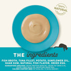 Zigly natural tuna broth cat food puree on blue plate, 100% natural ingredients, pet nutrition.