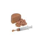 zigly soft brown pet food block with textured paste and a syringe for feeding
