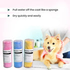Zigly pet absorption towels in pink, blue, yellow with dog being dried by towel, grooming setting
