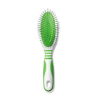 Zigly green and white pet grooming brush with oval head and metal bristles on white background