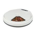 Zigly white automatic pet feeder with dry multicolor kibble in a triangular bowl