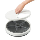 Hand opening round white and gray pill organizer with five compartments, zigly