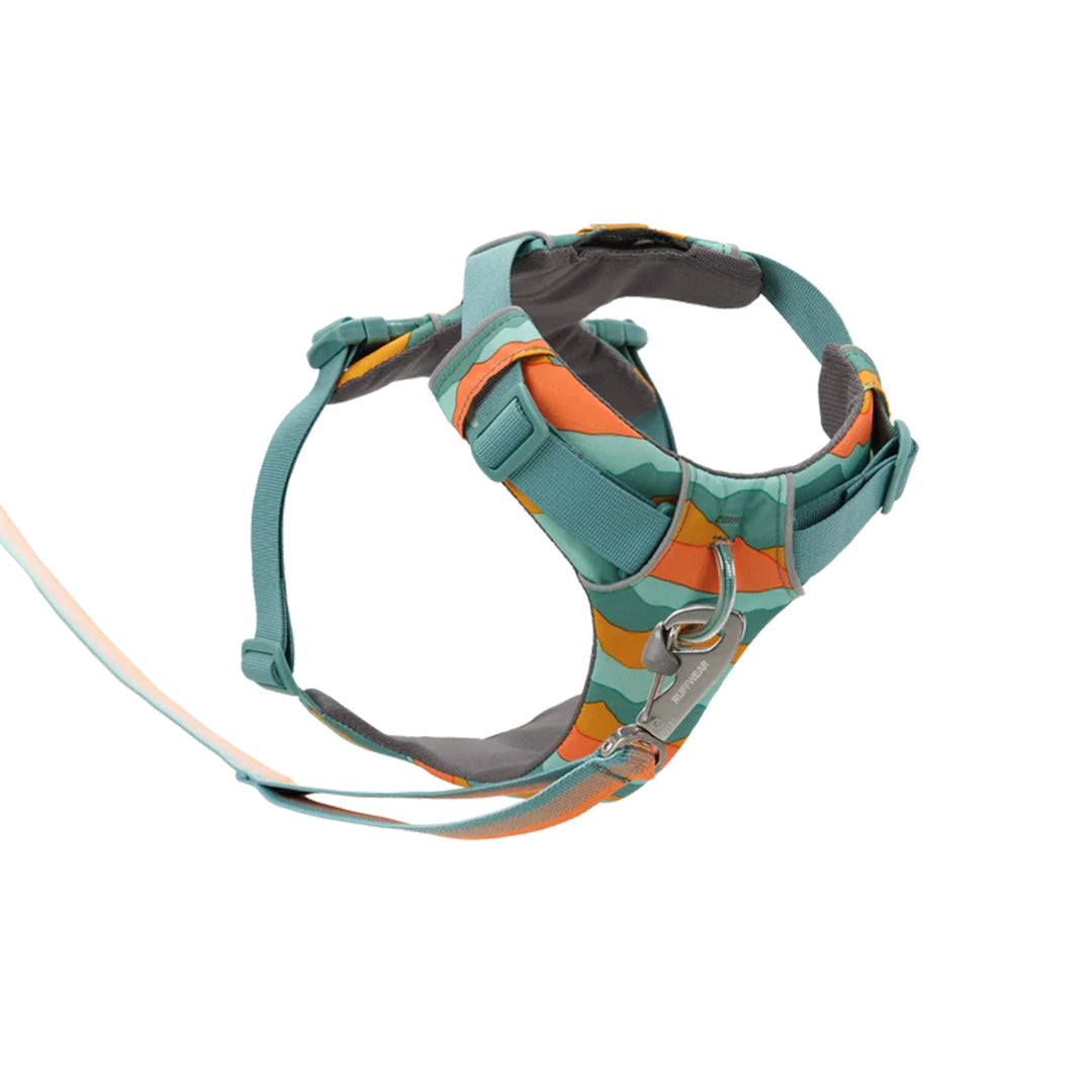zigly colorful dog harness with teal, orange, and grey stripes and metal clip on white background