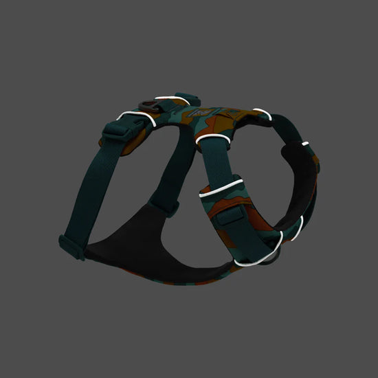 Zigly camouflage dog harness with adjustable black straps and reflective trim on gray background