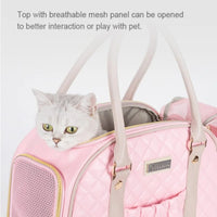 Zigly pink quilted pet carrier bag with breathable mesh panel and a silver tabby cat peeking out