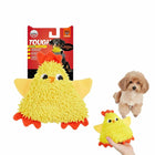 Zigly durable chew yellow chicken dog toy with orange feet and comb, small dog beside