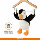 Zigly machine washable black and white plush puffin toy hanging on wooden hanger