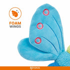 Close-up of blue plush foam wings with embroidered red and white circles on a FOFOS toy, zigly