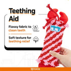 Zigly teething aid dog toy with red and pink flossy fabric held by hand for teething relief and teeth cleaning
