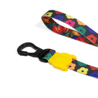 Colorful floral pattern dog leash with black clip and yellow zigly attachment