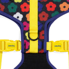 Zee.dog dog harness with yellow straps, colorful floral pattern, black D-ring, and zigly design