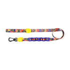 Colorful zigly dog leash with banana print and black clasp on white background