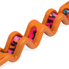 Close-up of Zigly orange wavy plastic handle with pink and black patterned fabric strap
