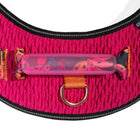 Close-up of pink textured fabric dog harness with padded zigly handle and metal D-ring