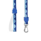 Blue zigly dog leash with wavy pattern and skull-shaped accents on white background