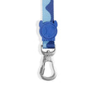 Blue zigly dog leash with wavy pattern and skull-shaped connector detail