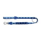 Zigly blue wave-patterned dog leash with padded handle and metal clip on white background
