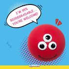 Red ball with three eyes smiling and speech bubble saying 95% biodegradable, Zigly eco-friendly squeeze toy