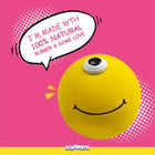 Yellow one-eyed smiley stress ball on pink background with speech bubble saying 100% natural rubber, zigly