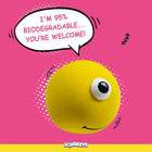 Zigly yellow stress ball with one eye and smile on pink background, caption 95% biodegradable