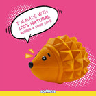 Zigly orange hedgehog toy made from 100% natural rubber on pink background with Squeezy dog toy brand
