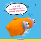 Orange cartoon character with bulging eyes on blue background saying 95% biodegradable, zigly eco-friendly toy