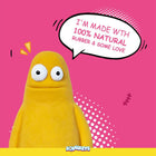 Yellow Squeezy toy on pink background saying it's made with 100% natural rubber and love - zigly