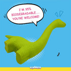 Green biodegradable dinosaur dog toy on blue background with zigly eco message