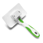 Zigly pet grooming brush with white and green handle on white background
