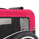 Zigly red and black pet trailer with mesh window and logo next to bicycle tire