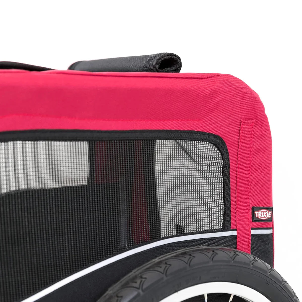 Zigly red and black pet trailer with mesh window and logo next to bicycle tire