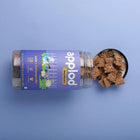 Applod Lamb & Ashwagandha dog biscuits in jar with treats spilling out, zigly