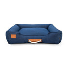 Blue pet bed with leather handle and tag, ideal for cozy comfort zigly