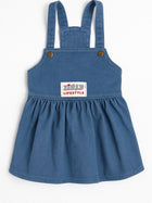 Blue denim baby dress with straps and Zigly Lifestyle logo patch on front